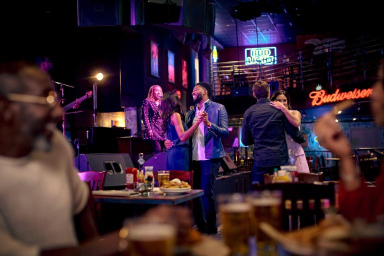 A couple dancing to a live blues band