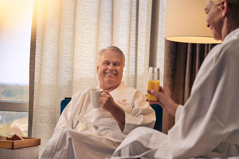 A couple having a breakfast in the comfort of their room 