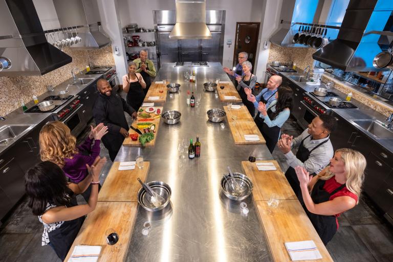 Bird's eye view of a class learning in the culinary studio