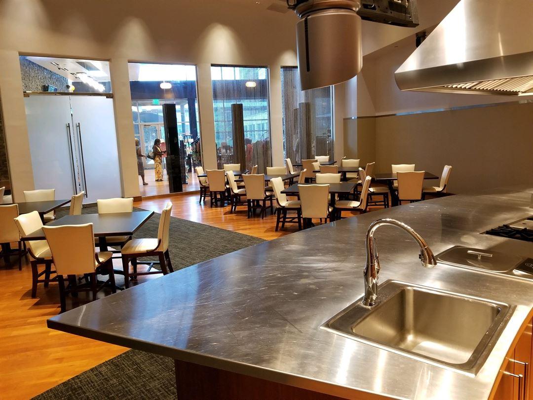 the culinary studio demonstration space with tables and chairs