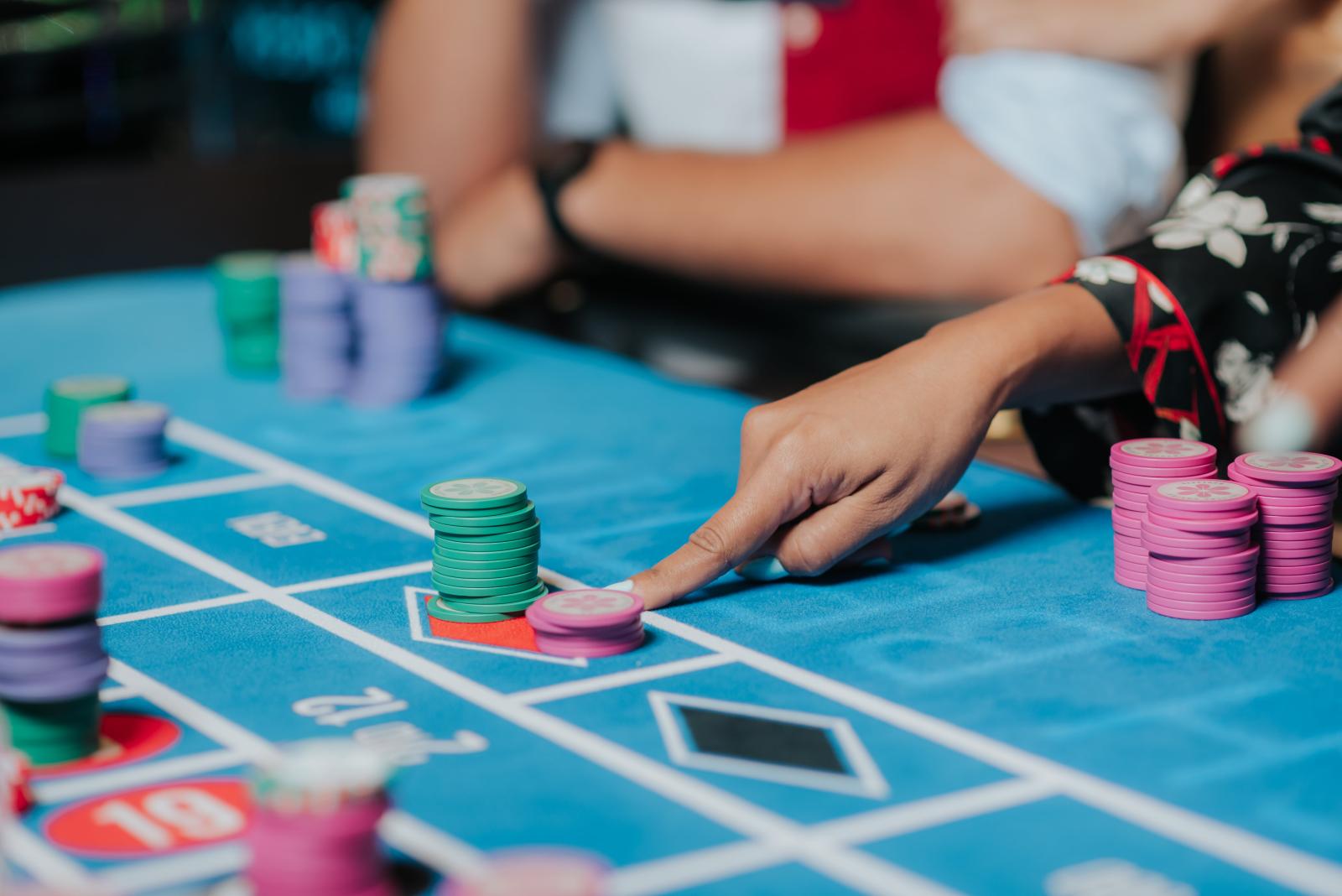 People playing table games at a casino