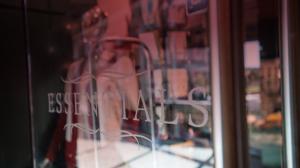 Essentials logo on a glass window