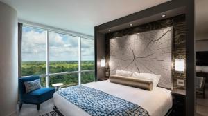 View of a king-sized bed near a window