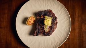 Perfectly cooked steak with sautéed garlic and butter sauce