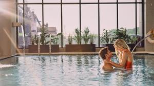 A couple enjoying the pool at Wind Creek Bethlehem
