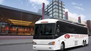 Large white motorcoach branded Wind Creek Bethlehem