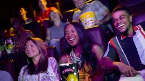People watching a move in the theater
