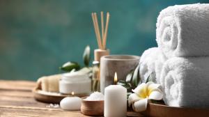 Spa and wellness-related items arranged on a wooden surface