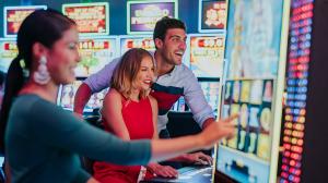 Three people playing casino games