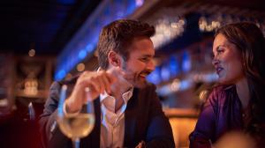 A couple enjoying conversation over a meal