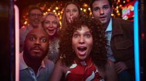 A group of people looking at the camera with faces of excitement